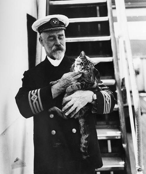 640px-captain_a-_j-_hailey_in_uniform_with_a_cat_on_the_first_c-p-_r-m-s-_empress_of_canada-8044131